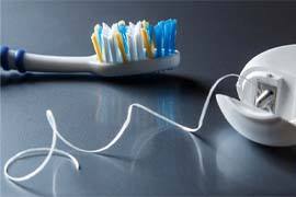 Close up of toothbrush and floss