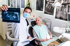 Woman smiling during her dental appointment