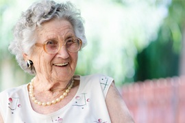 Smiling older woman outdoors