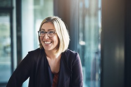 a smiling woman with glasses