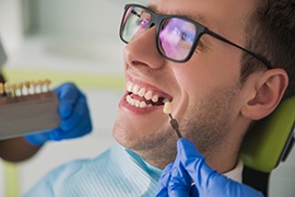 a man with a missing tooth a the dentist