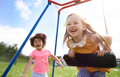 Laughing girls playing outside