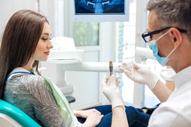 A dentist explaining the dental implant process