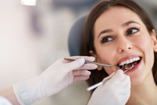 Woman getting an exam from a dentist in Corpus Christi