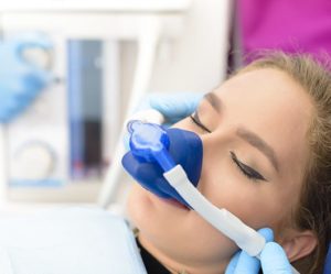 Woman using nitrous oxide at dentist